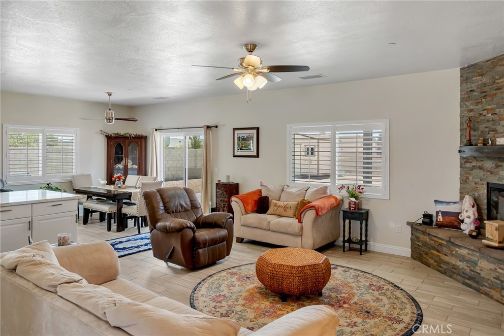 13178 Setancket Road Apple Valley, CA 92308 - Photo 5 of 24 a living room with furniture or couch and a window