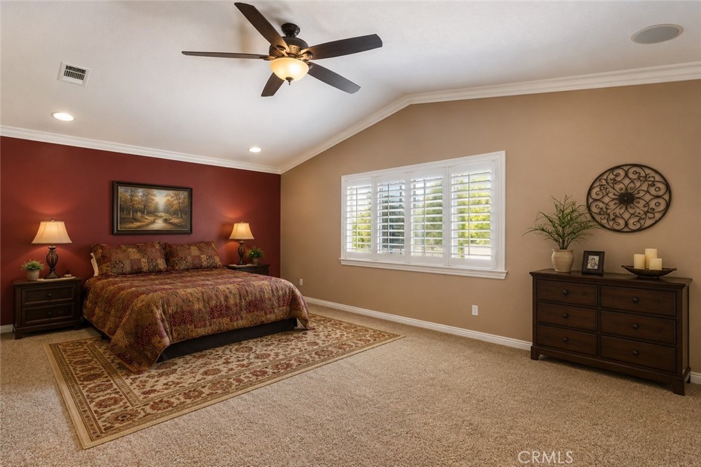 33351 Nicholas Common Temecula, CA 92592 - Photo 20 of 42 a bedroom with a bed and a chandelier