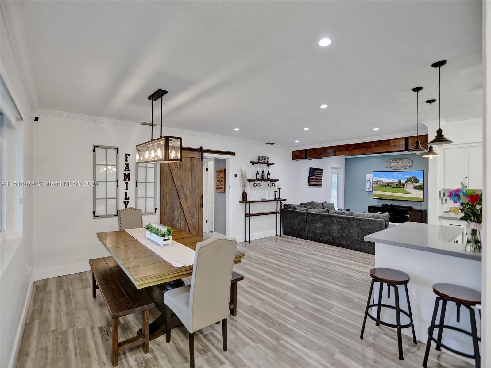 8380 Taft Street Pembroke Pines, FL 33024 - Photo 1 of 42 a view of a dining room with furniture