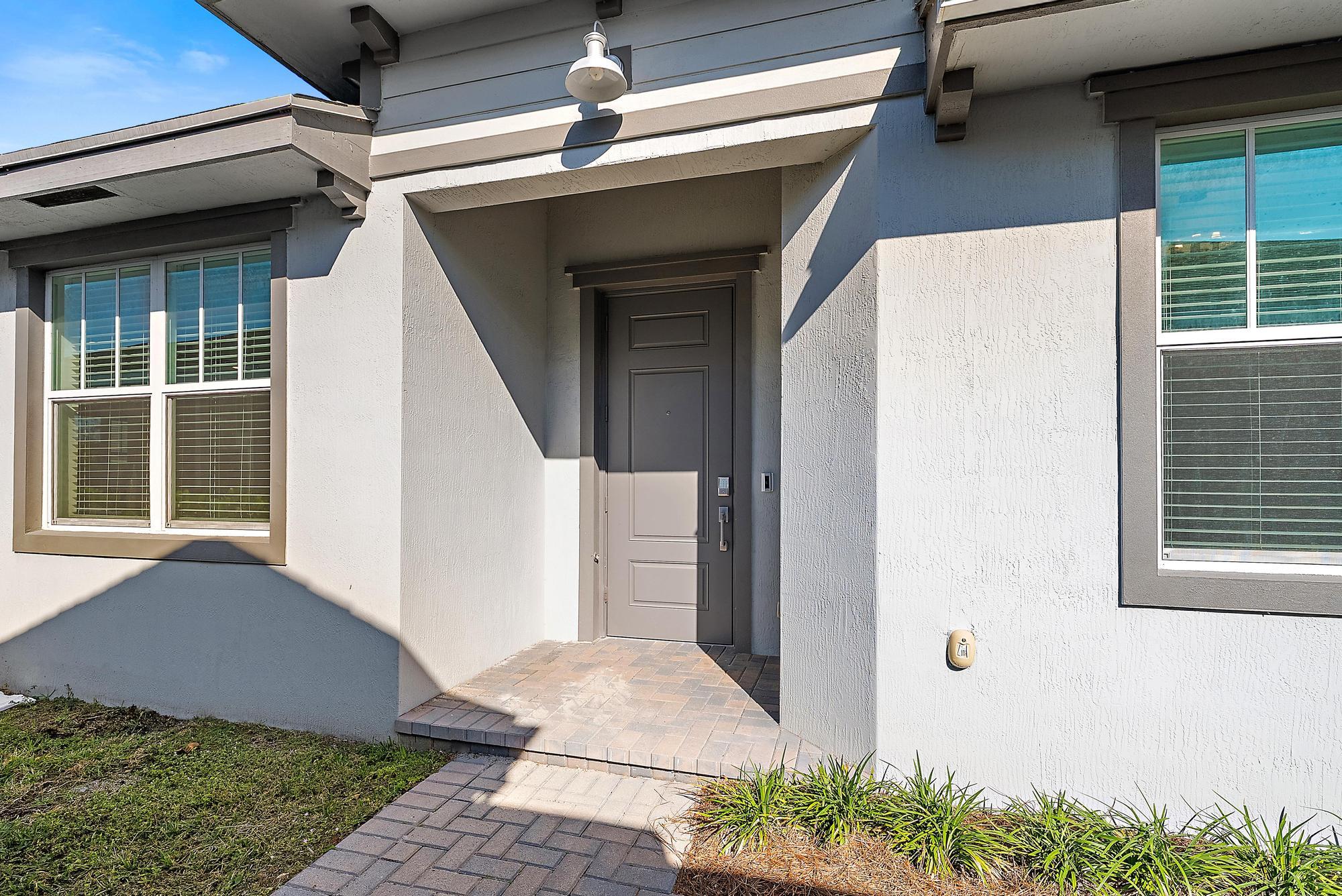 1283 Tangled Orch Trace Loxahatchee, FL 33470 - Photo 3 of 21 a view of house with outdoor space