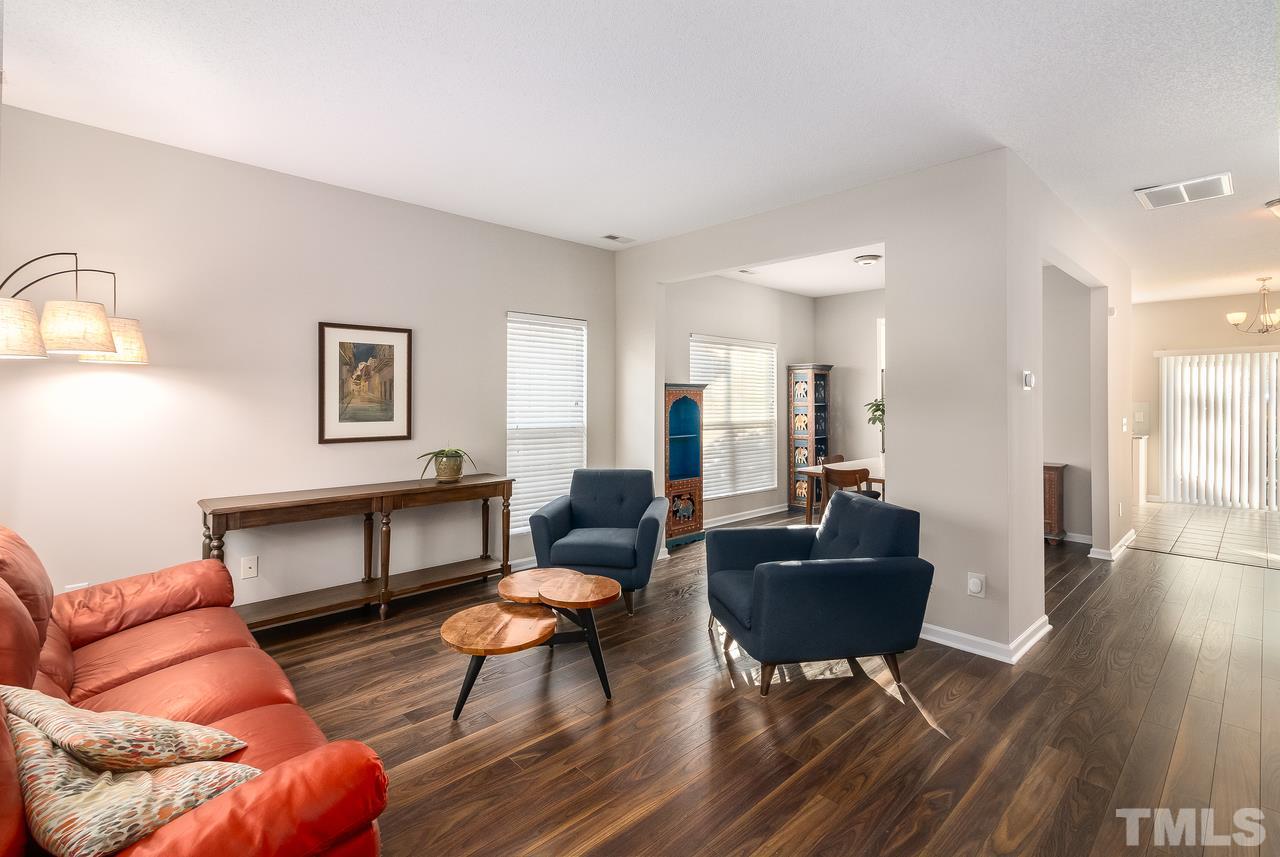 8 Sharpstone Lane Durham, NC 27703 - Photo 2 of 15 a living room with furniture a rug and a window