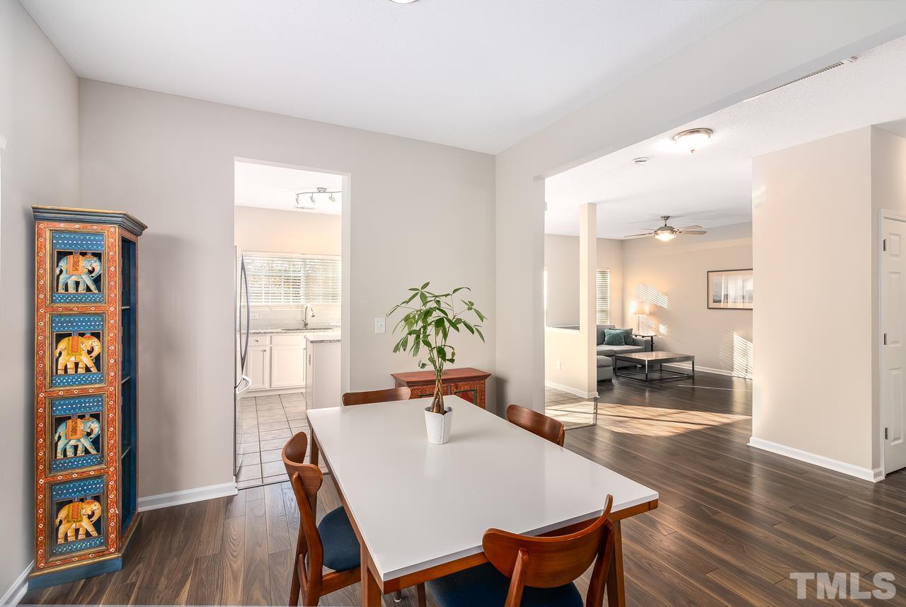 8 Sharpstone Lane Durham, NC 27703 - Photo 3 of 15 a view of a dining room with furniture and wooden floor
