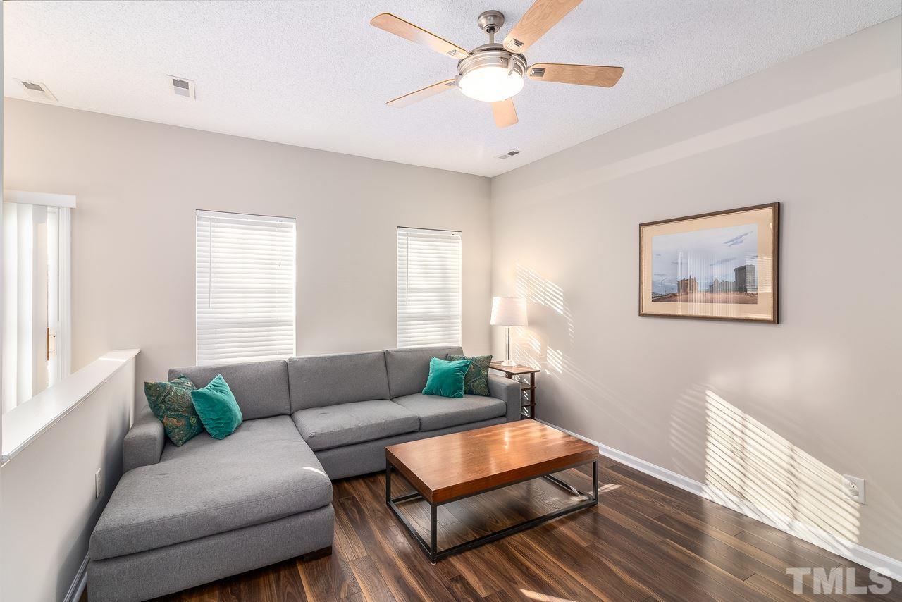 8 Sharpstone Lane Durham, NC 27703 - Photo 5 of 15 a living room with furniture and a large window