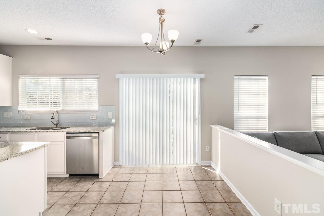 8 Sharpstone Lane Durham, NC 27703 - Photo 6 of 15 a kitchen with stainless steel appliances granite countertop a sink and a stove