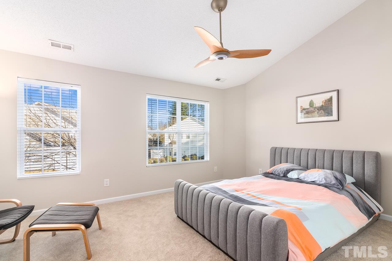 8 Sharpstone Lane Durham, NC 27703 - Photo 9 of 15 a bedroom with bed and window