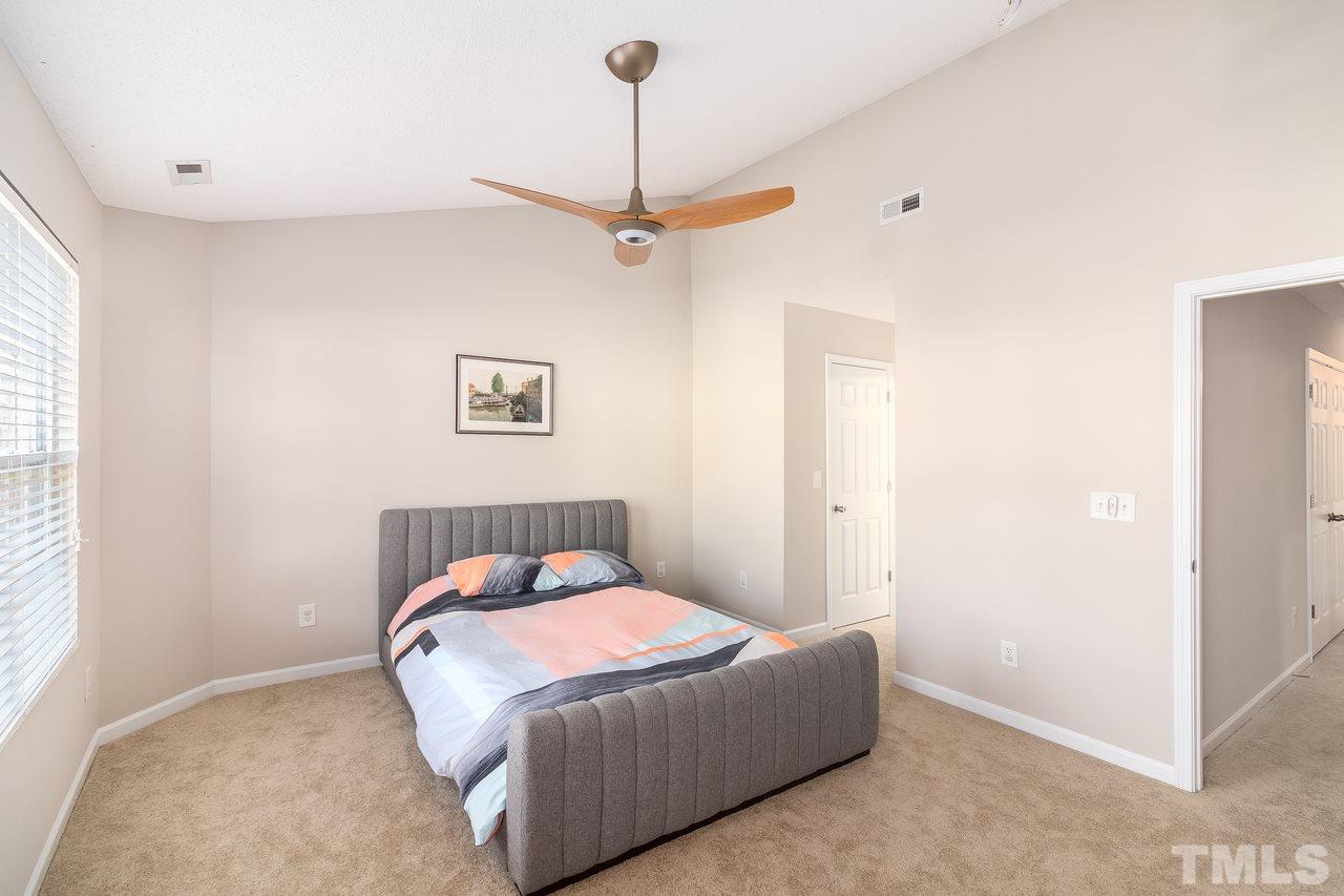 8 Sharpstone Lane Durham, NC 27703 - Photo 10 of 15 a bedroom with a bed and a window
