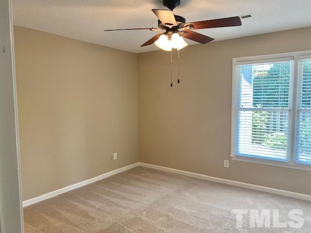 6412 Meadow View Drive Raleigh, NC 27609 - Photo 13 of 13 an empty room with a window and a fan