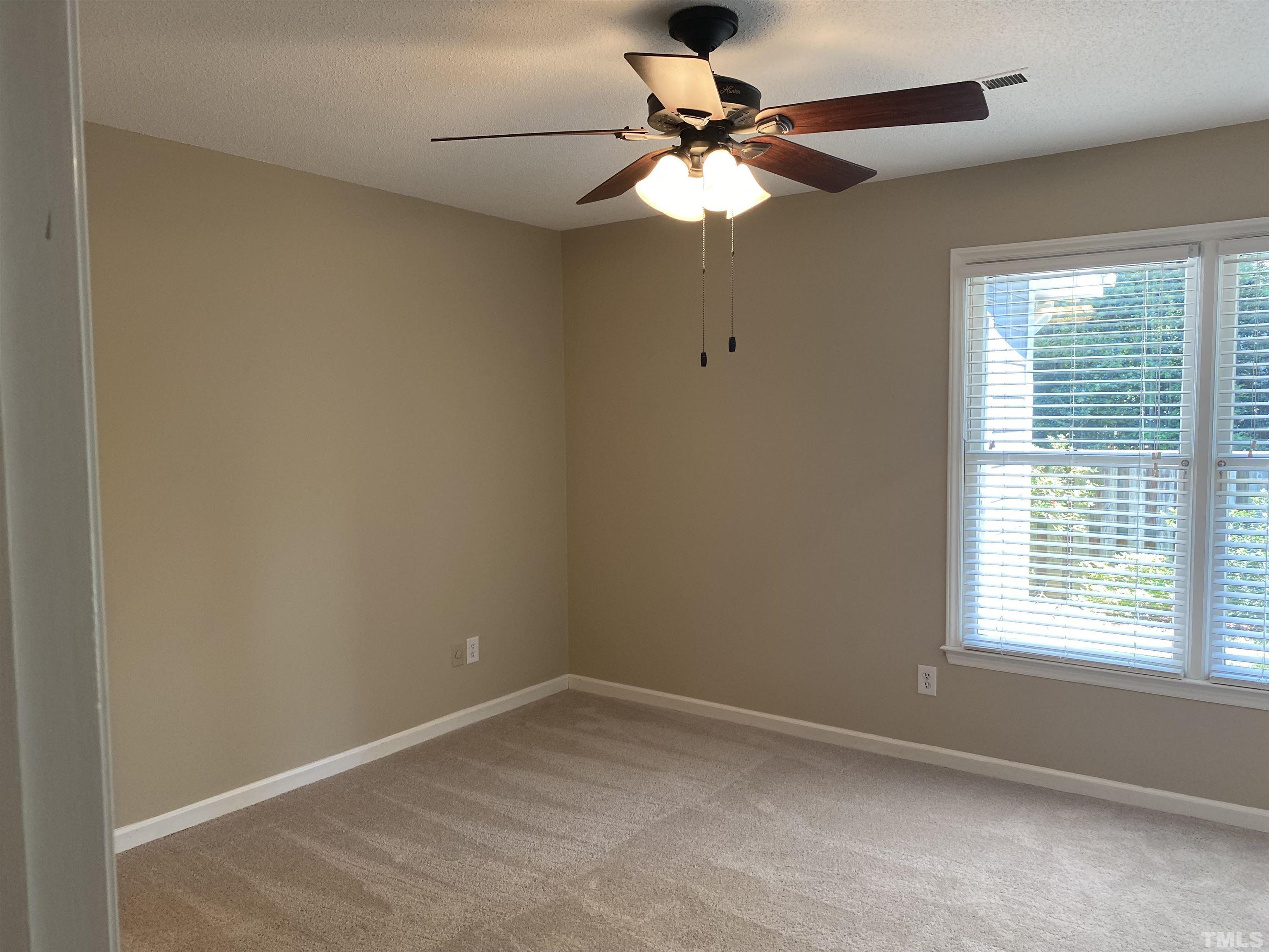 6412 Meadow View Drive Raleigh, NC 27609 - Photo 4 of 13 an empty room with a window