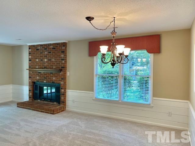 6412 Meadow View Drive Raleigh, NC 27609 - Photo 5 of 13 a view of livingroom with furniture and a fireplace