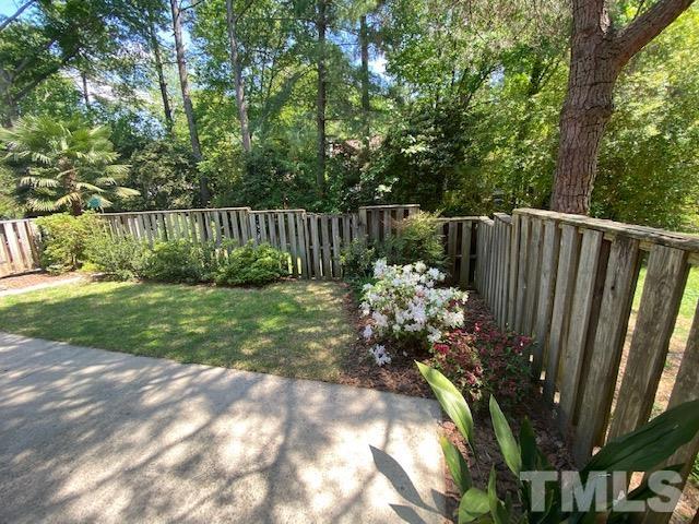 6412 Meadow View Drive Raleigh, NC 27609 - Photo 8 of 13 a view of garden with plants and wooden fence