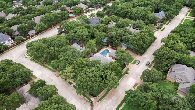 an aerial view of house with yard