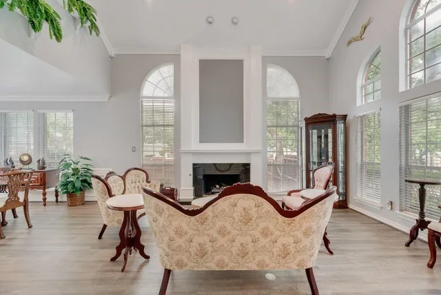 a view of a dining room with furniture window and wooden floor
