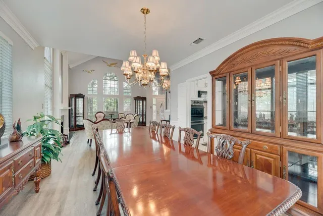 a kitchen with granite countertop a sink a counter top space appliances and cabinets