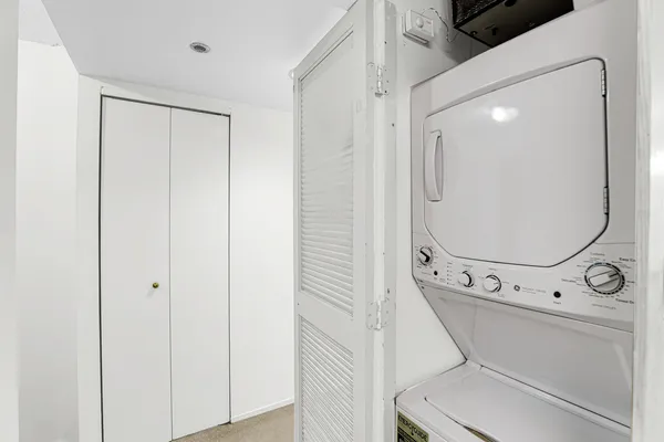 a bathroom with a toilet and a mirror