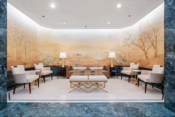 a living room with furniture and a rug