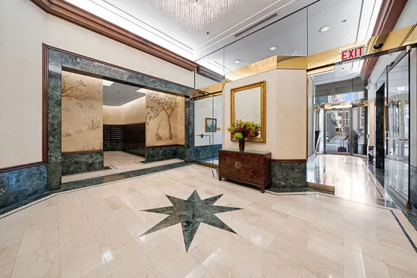 a lobby with furniture and a large window