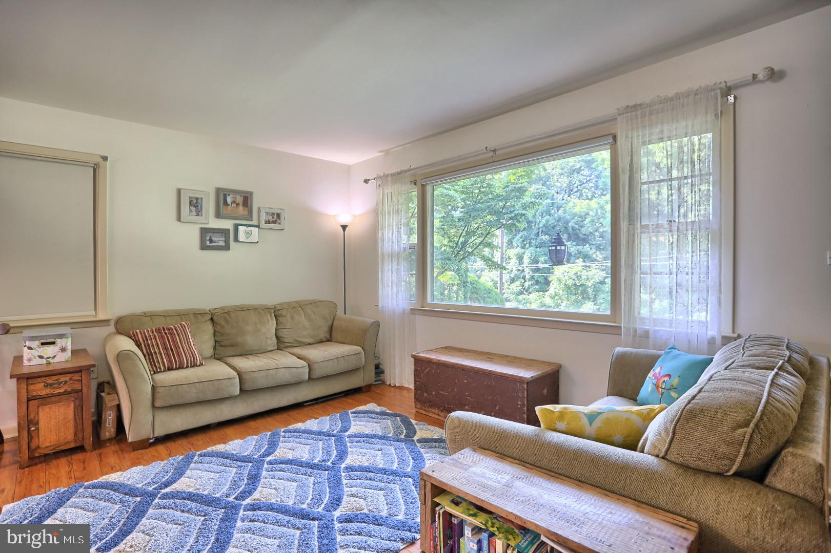 2345 River Road Reading, PA 19605 - Photo 1 of 28 a living room with furniture and a large window