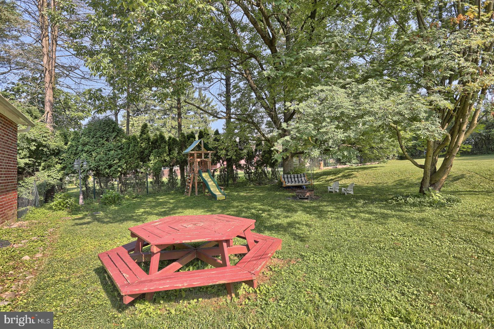 2345 River Road Reading, PA 19605 - Photo 13 of 28 a backyard of a house with yard and outdoor seating
