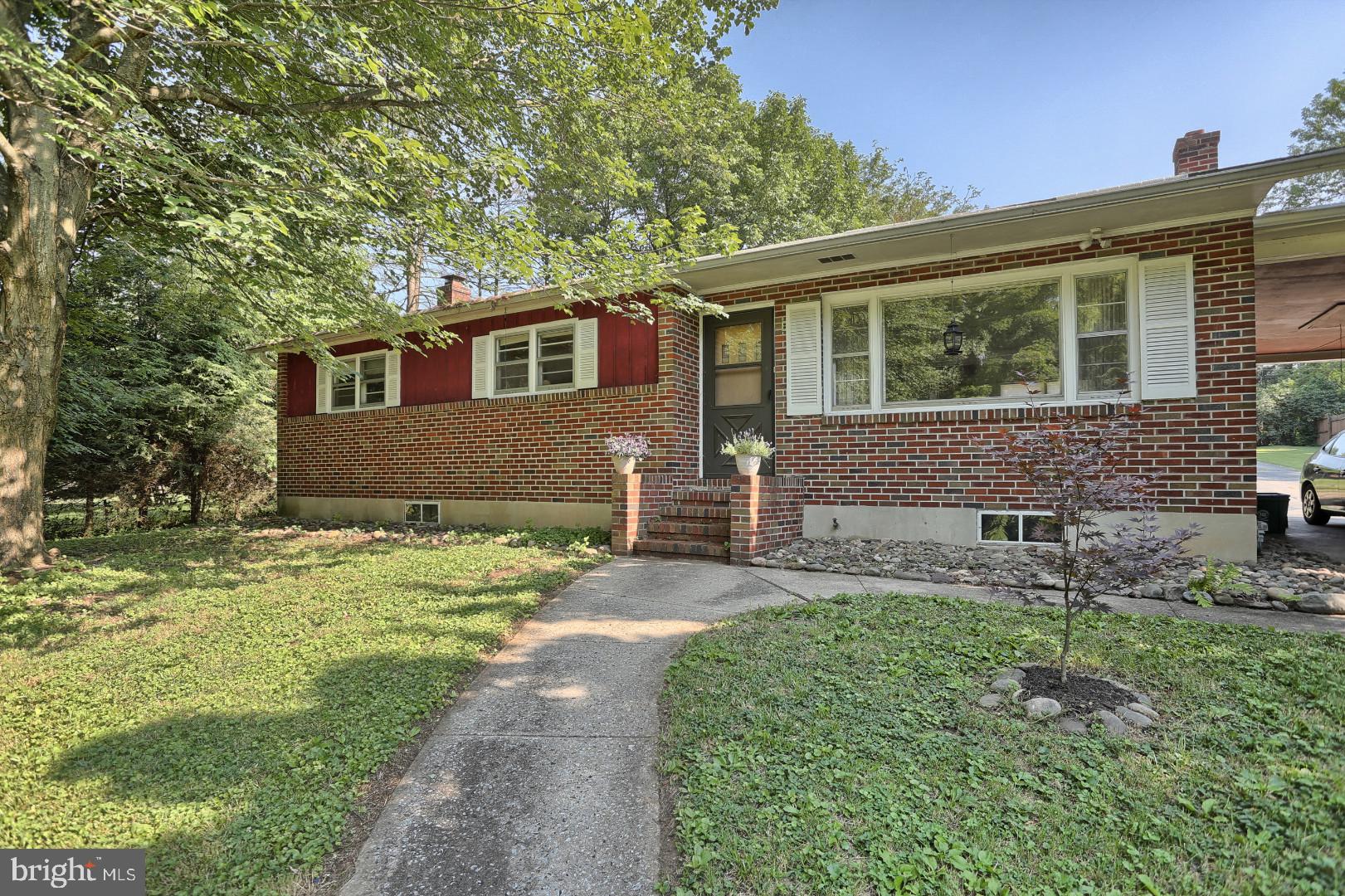 2345 River Road Reading, PA 19605 - Photo 21 of 28 a front view of a house with a garden