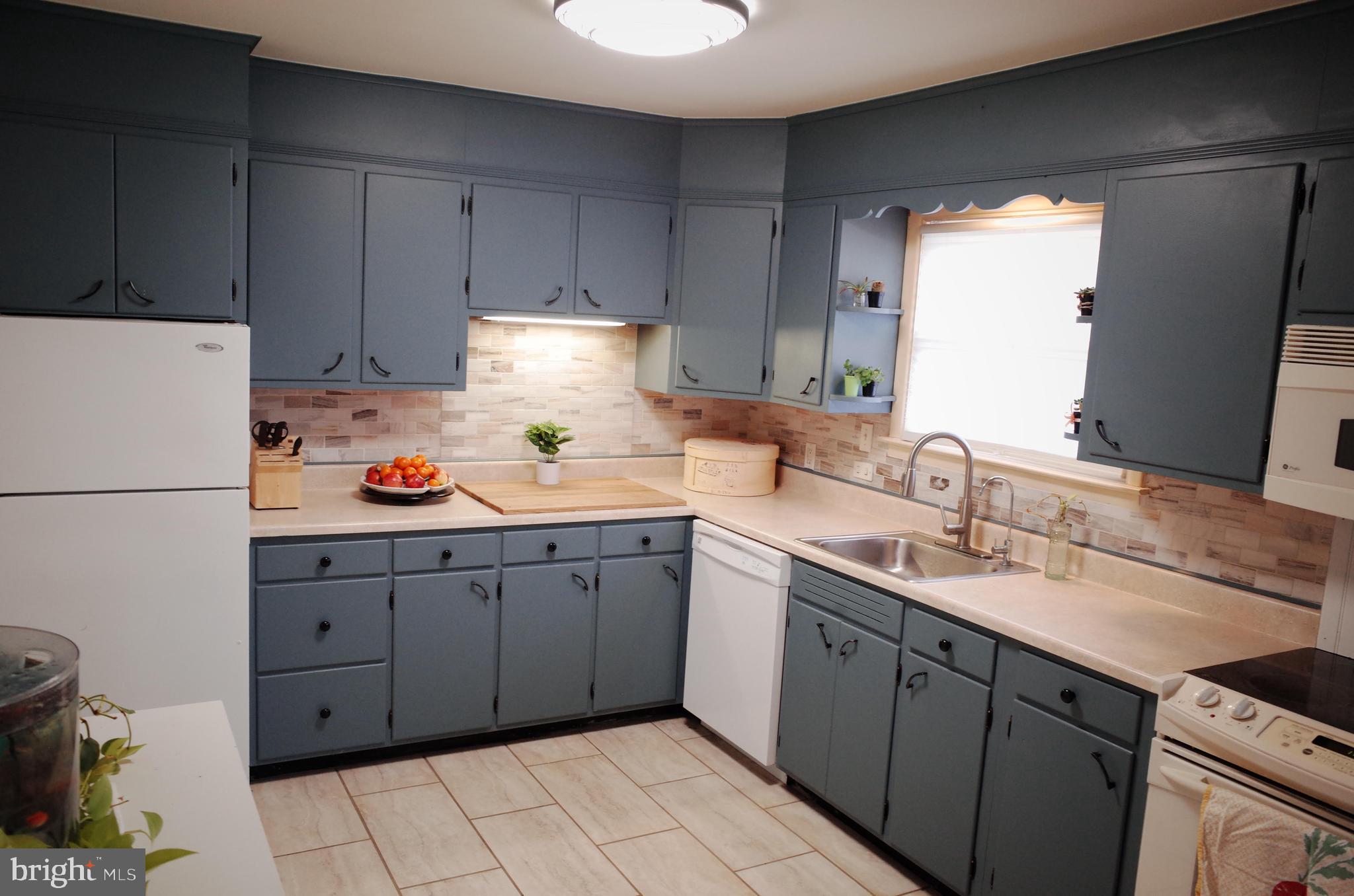 2345 River Road Reading, PA 19605 - Photo 26 of 28 a kitchen with a sink dishwasher and a refrigerator