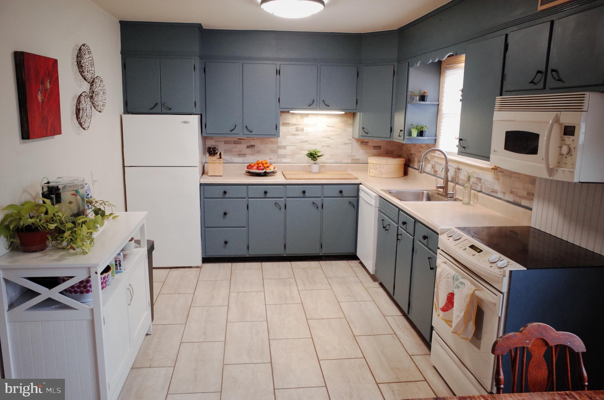 2345 River Road Reading, PA 19605 - Photo 28 of 28 a kitchen with a sink refrigerator and cabinets