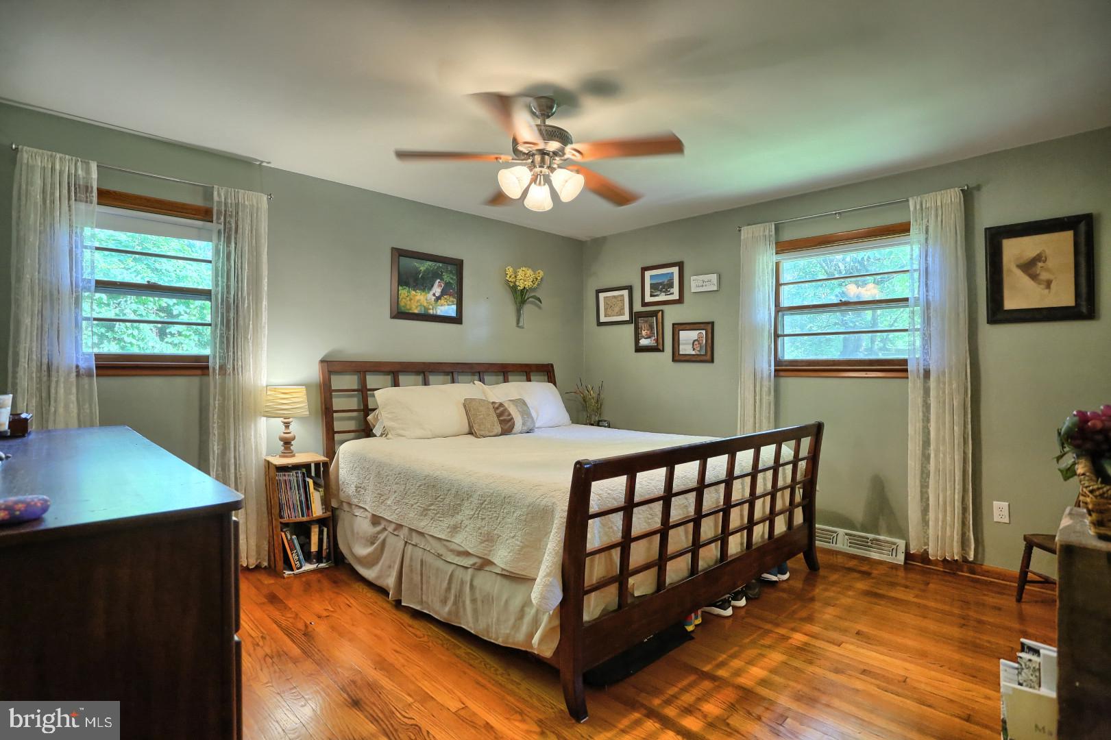 2345 River Road Reading, PA 19605 - Photo 6 of 28 a bedroom with a bed and a chandelier