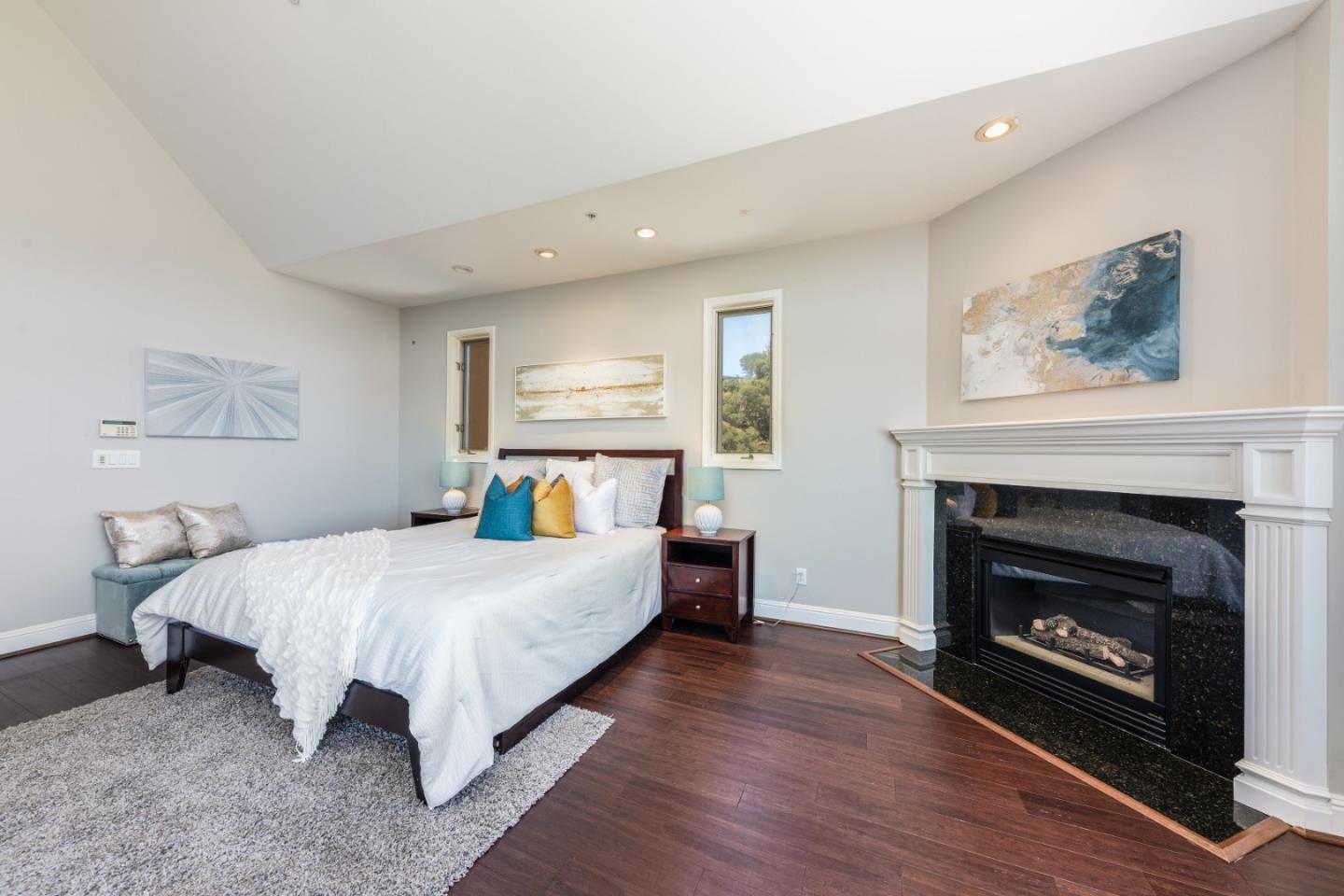 24 Shratton Avenue San Carlos, CA 94070 - Photo 7 of 13 a bedroom with a bed and a fireplace