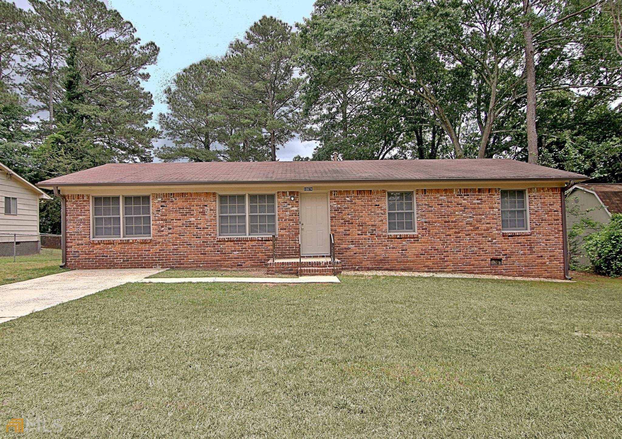 10674 Panhandle Road Hampton, GA 30228 - Photo 1 of 1 front view of a house and a yard