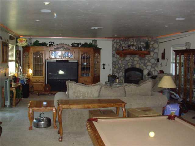 9416 Lake Canyon Road Santee, CA 92071 - Photo 1 of 15 Huge Family Room with crow molding, indirect lighting and gas fireplace.