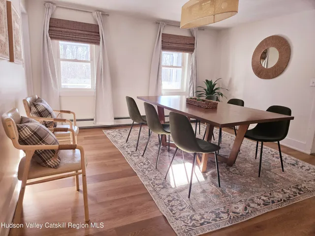 a kitchen with kitchen island granite countertop a stove a sink and a refrigerator