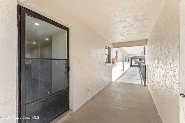 a view of a hallway with some doors