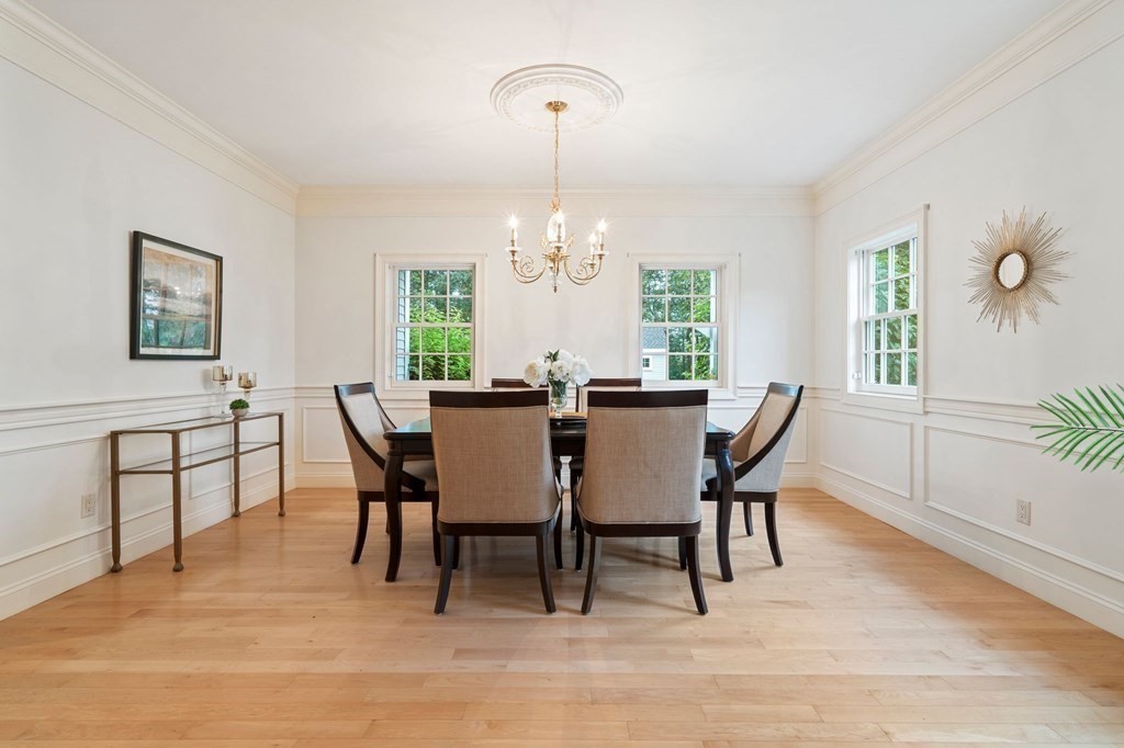 38 Pheasant Lane Manchester, NH 03109 - Photo 11 of 42 a view of a dining room with furniture window and wooden floor