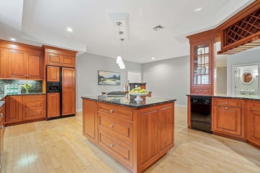 38 Pheasant Lane Manchester, NH 03109 - Photo 17 of 42 a kitchen with stainless steel appliances granite countertop a stove and a refrigerator