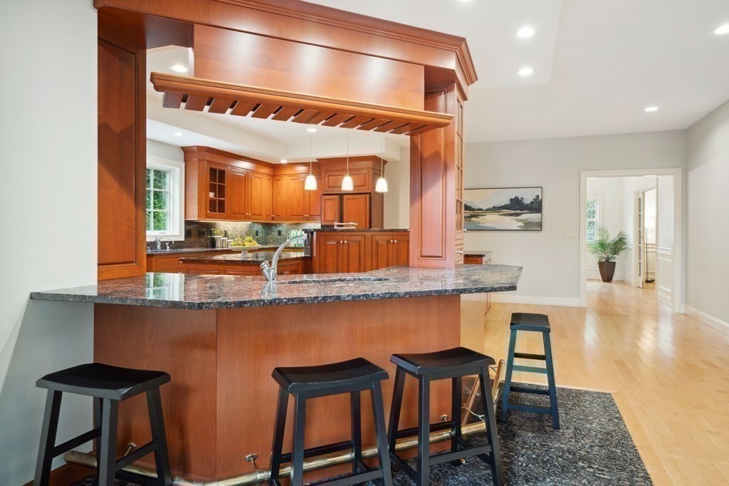 38 Pheasant Lane Manchester, NH 03109 - Photo 18 of 42 a kitchen with a table and chairs in it