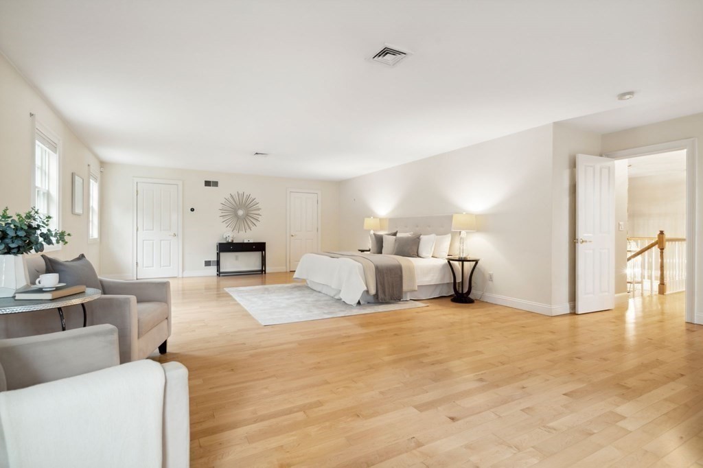 38 Pheasant Lane Manchester, NH 03109 - Photo 23 of 42 a bed room with furniture and a couch