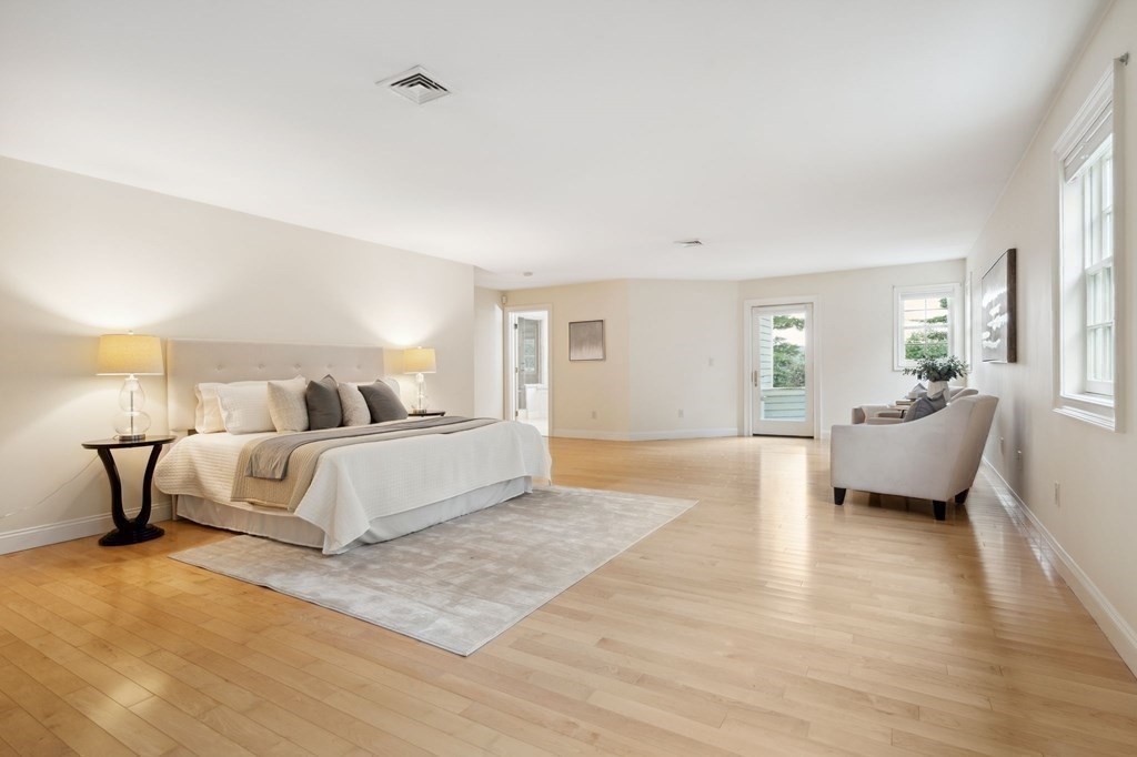 38 Pheasant Lane Manchester, NH 03109 - Photo 24 of 42 a spacious bedroom with a bed and a couch