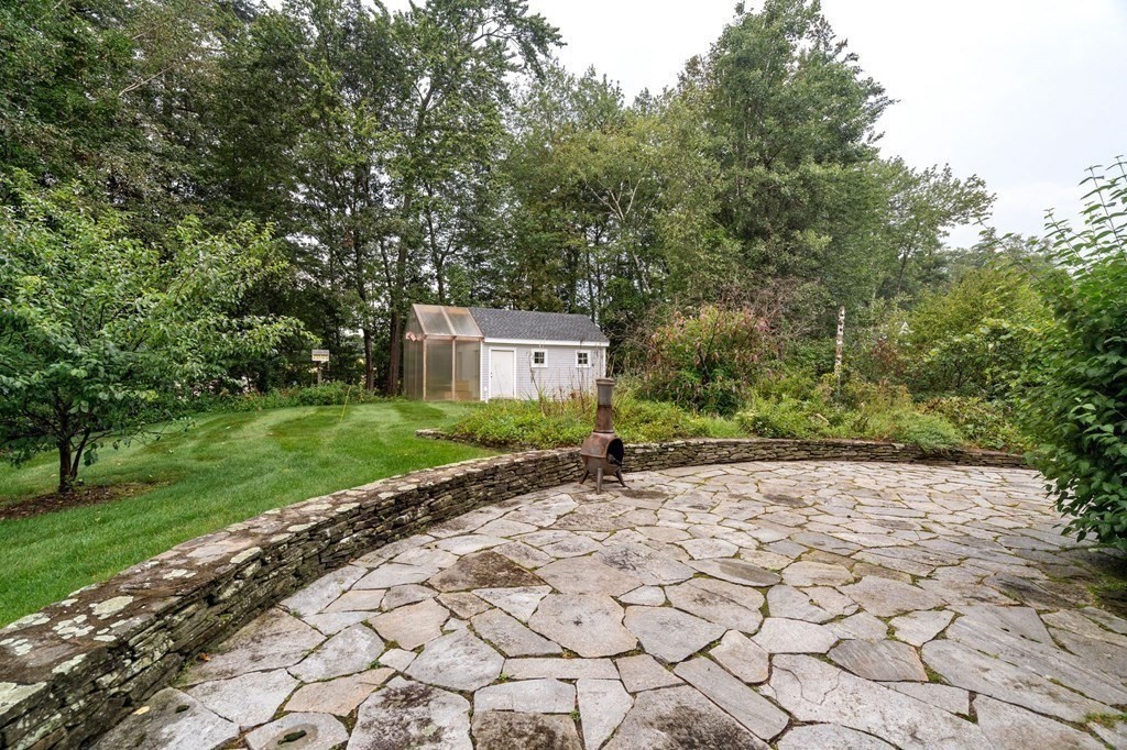 38 Pheasant Lane Manchester, NH 03109 - Photo 40 of 42 a pathway of a house with a yard