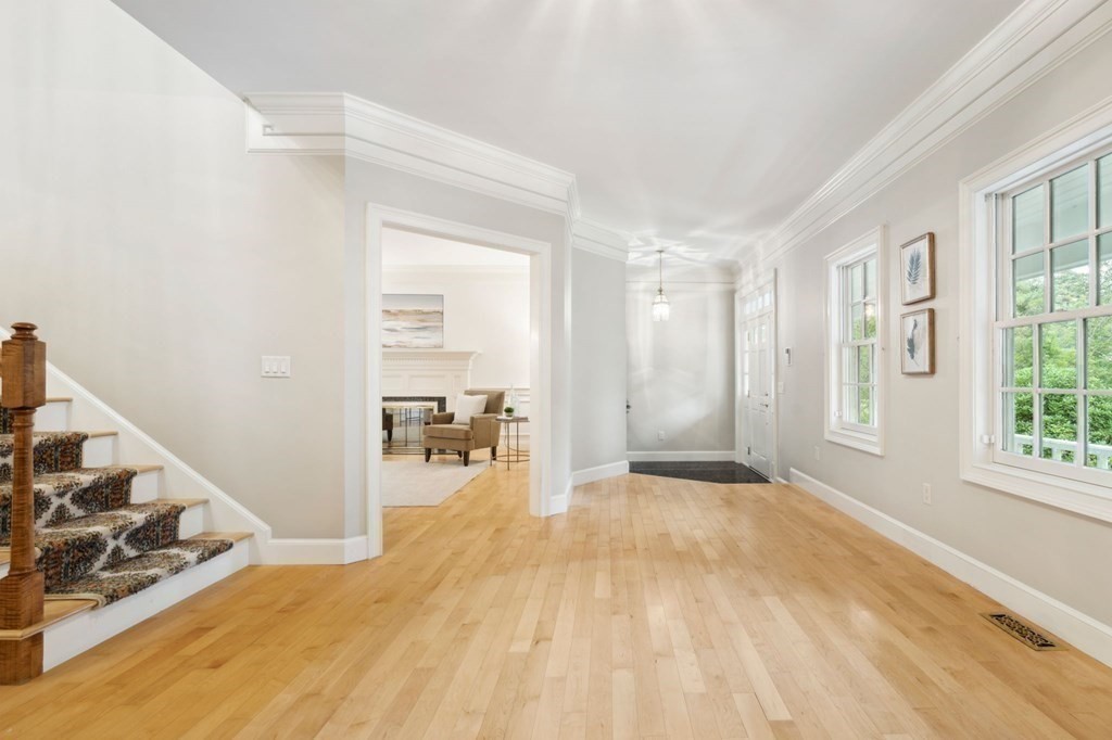 38 Pheasant Lane Manchester, NH 03109 - Photo 5 of 42 a view of empty room with wooden floor and windows