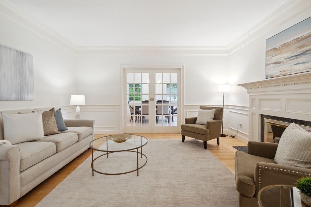 38 Pheasant Lane Manchester, NH 03109 - Photo 10 of 42 a living room with furniture and a fireplace