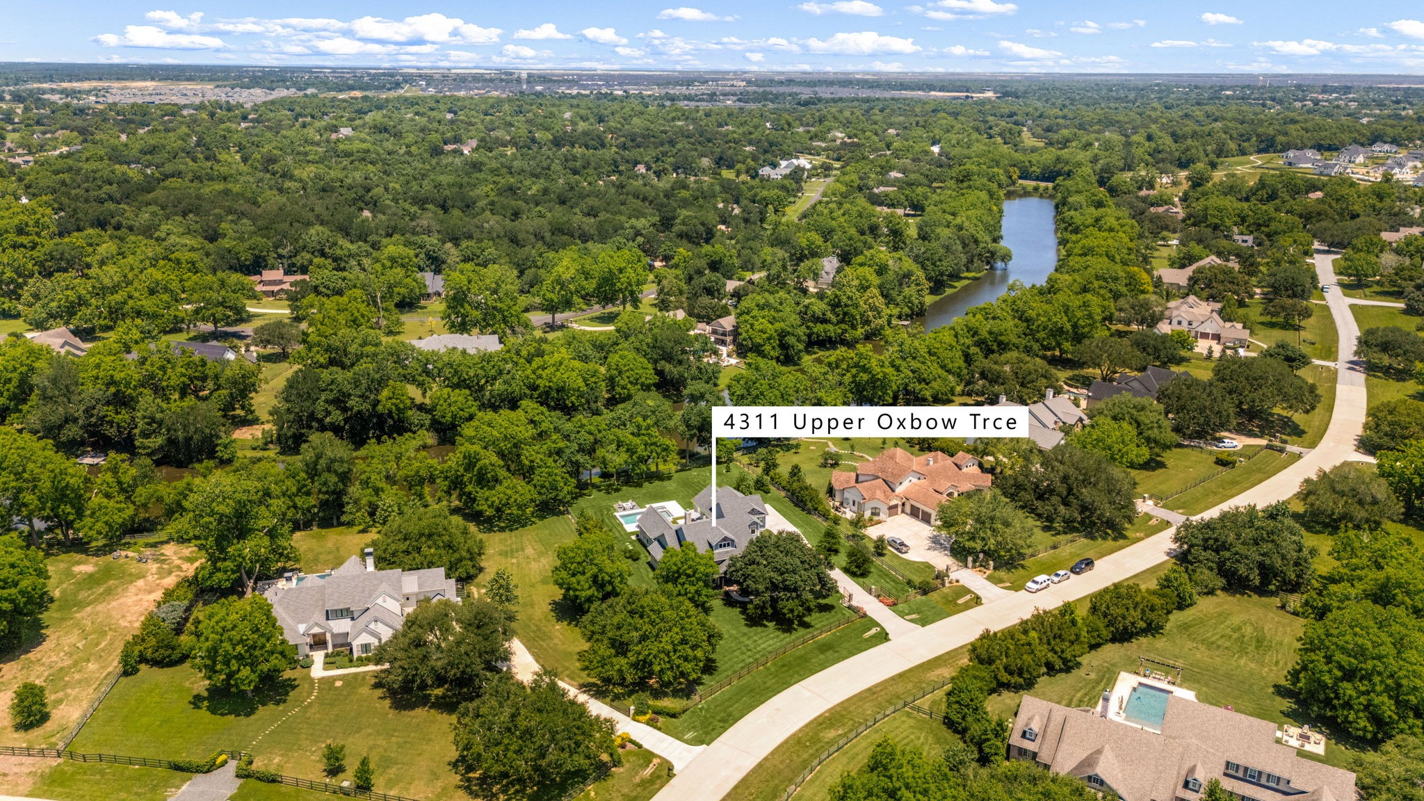 4311 Upper Oxbow Trace Fulshear, TX 77441 - Photo 47 of 49 Located in a prestigious acreage community, this remarkable property offers privacy, expansive green space, and picturesque surroundings.