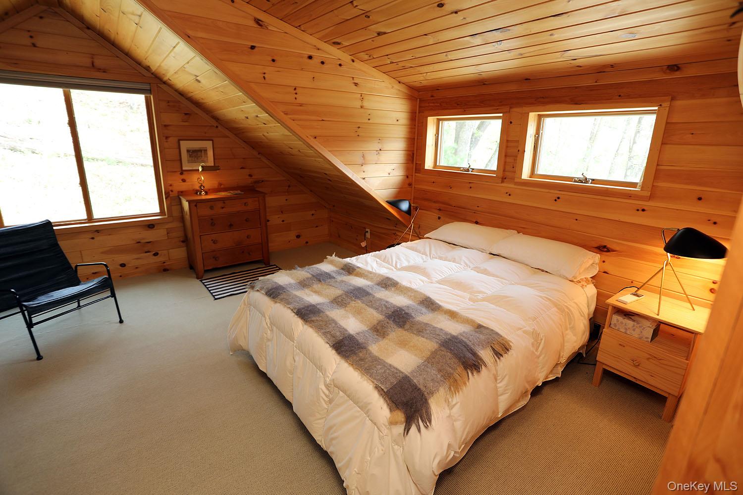 5120 Peas Eddy Road Hancock, NY 13783 - Photo 30 of 37 a bedroom with a bed next to a window