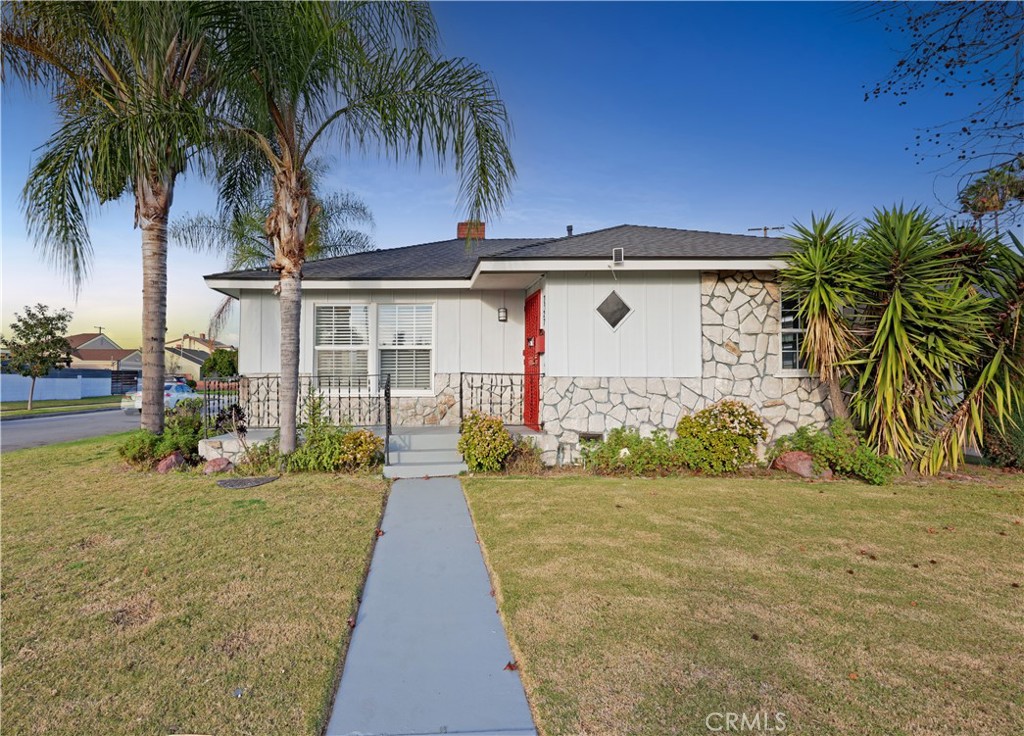 7927 Brookmill Road Downey, CA 90241 - Photo 2 of 24 a front view of house with yard and yellow space