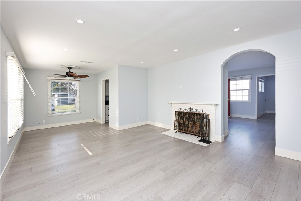 7927 Brookmill Road Downey, CA 90241 - Photo 4 of 24 an empty room with windows and fireplace