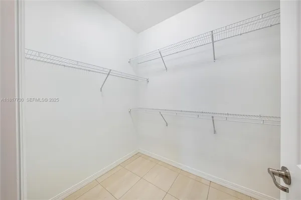 a bed room with a bed and a window