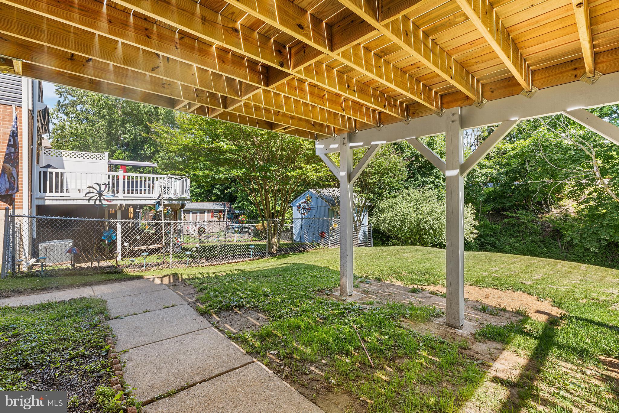 26 Virginia Circle Ridley Park, PA 19078 - Photo 47 of 49 a view of a backyard with table and chairs and potted plants