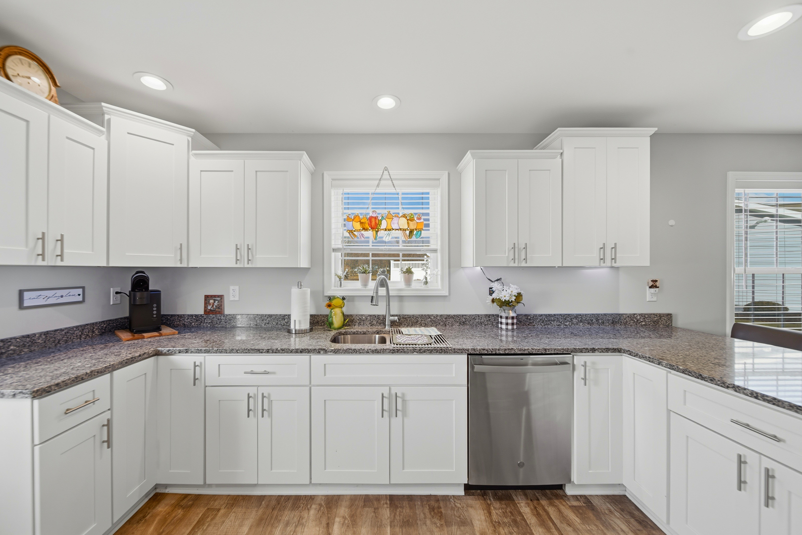1525 Eadens Place Dixon, IL 61021 - Photo 14 of 30 a kitchen with granite countertop white cabinets white appliances and sink