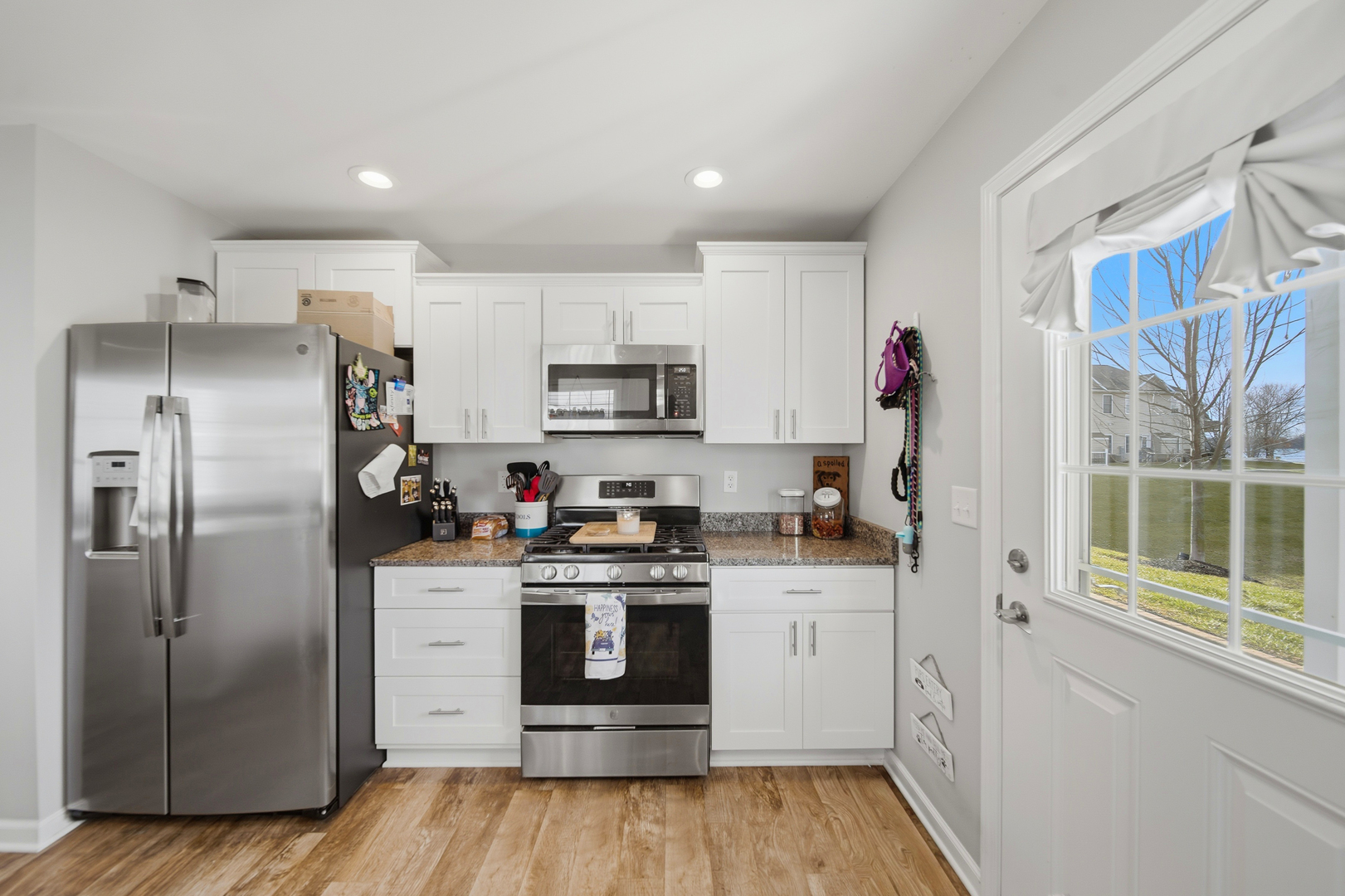 1525 Eadens Place Dixon, IL 61021 - Photo 18 of 30 a kitchen with a refrigerator and a stove top oven
