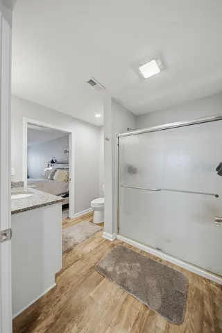 a bathroom with a shower and a toilet