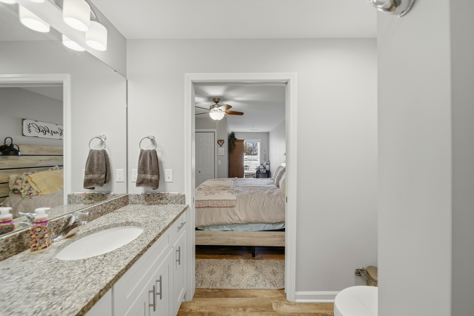 1525 Eadens Place Dixon, IL 61021 - Photo 23 of 30 a en suite bathroom with a granite countertop sink and a mirror