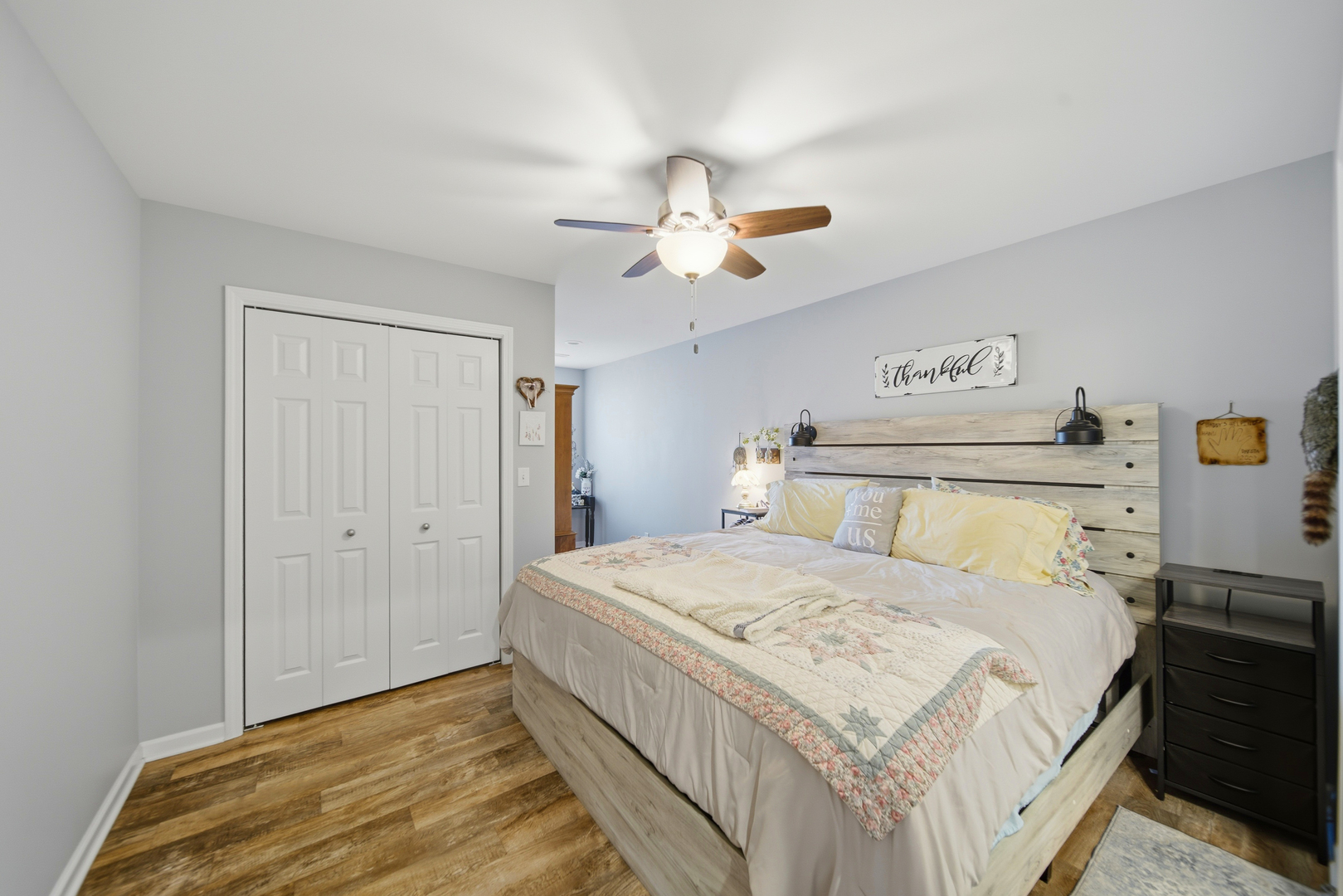 1525 Eadens Place Dixon, IL 61021 - Photo 24 of 30 a bedroom with a bed and a chandelier